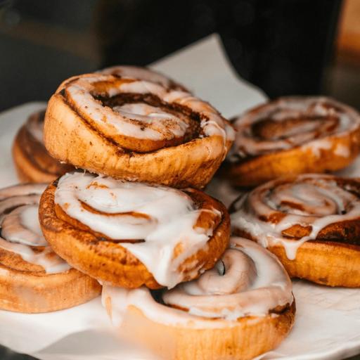 Classic Bakendales cinnamon rolls, with swirls of cinnamon and generous glazes of creamy white frosting.