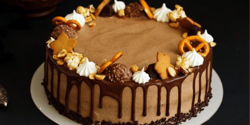 Bakendales signature cake with chocolate glaze and assorted toppings